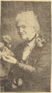 Another newspaper clipping of Bridget Cosgrave, in her later ysers with white curly hair and spectacles.
